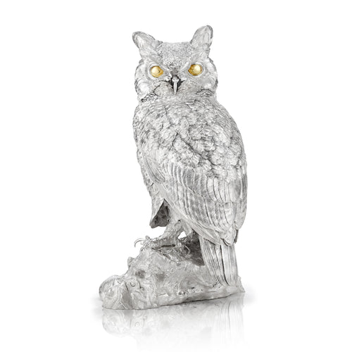 A magnificent sculpture of a Great Horned Owl, created as a gift in sterling silver and set with 18 carat gold eyes.