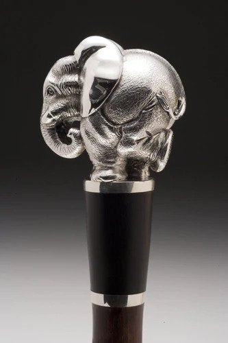An African hardwood walking stick crowned with an elephant in Sterling Silver.