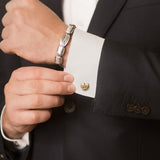 Model Wearing Hippo Heart Cufflinks in 18K Gold and Mens Elephant Hair Bangle in Sterling Silver
