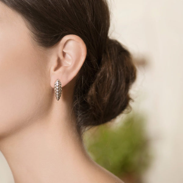 Model Wearing Pangolin Earrings in Sterling Silver