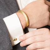 Model Wearing Pangolin Scale Cufflinks in 18K Gold and Pangolin Armour Bangle in 18K Gold