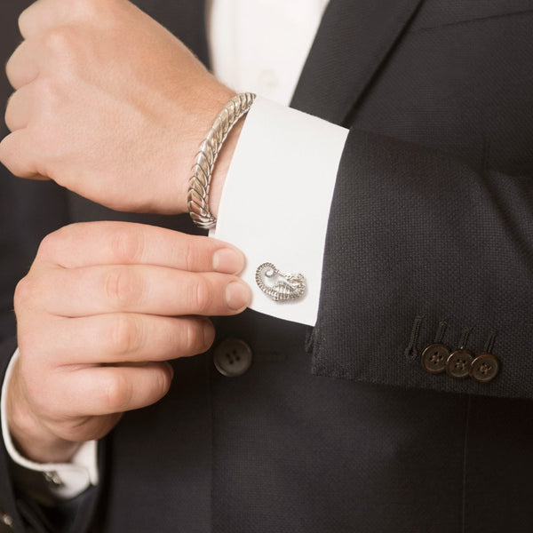Model Wearing Seahorse Cufflinks in Sterling Silver and Pangolin Armour Bangle in Sterling Silver